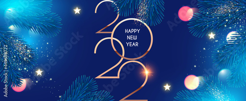 Happy new 2022 year! Elegant text with fir tree branches and light bokeh effect. Minimalistic text template