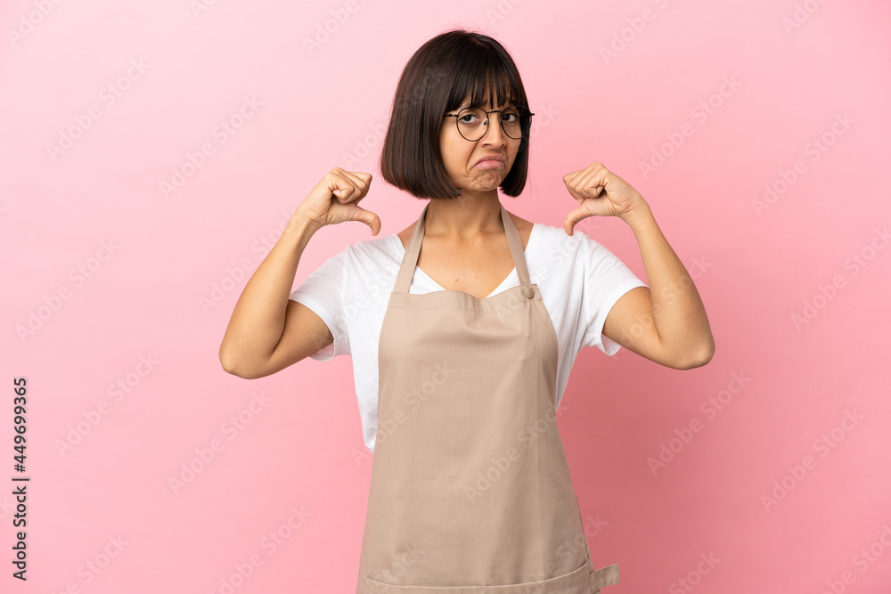Restaurant waiter over isolated pink background proud and self-satisfied Restaurant waiter over isolated pink background proud and self-satisfied