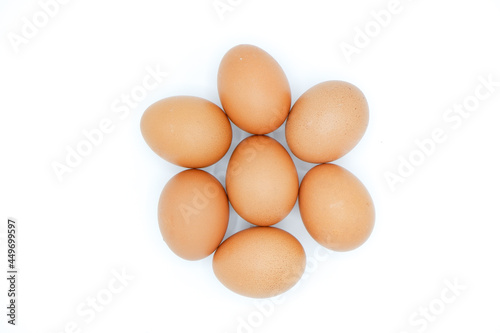 7 chicken eggs on a white background