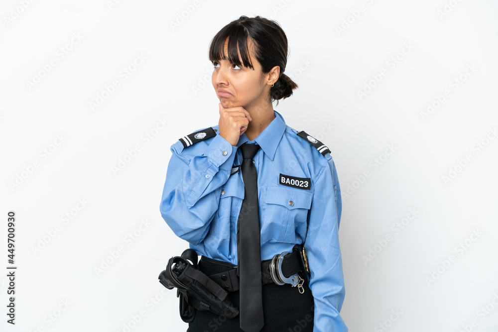 Young police mixed race woman isolated background having doubts Young police mixed race woman isolated background having doubts