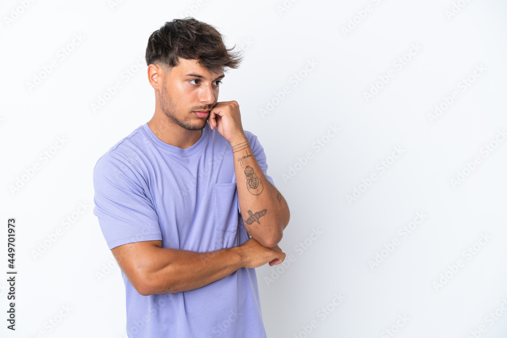 Young caucasian handsome man isolated on white background with tired and bored expression Young caucasian handsome man isolated on white background with tired and bored expression