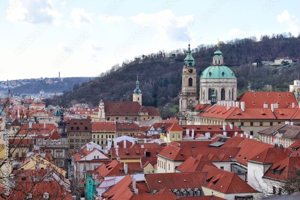 High angle view of historical sights with terracotta roof tiles in Prague, capital of the Czech Republic.