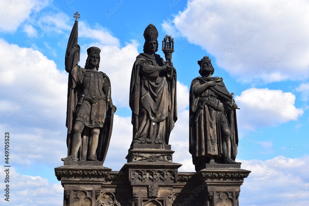 The statue of Saints Norbert of Xanten, Wenceslas and Sigismund on the medieval gothic Charles Bridge in Prague built on the 15th century.