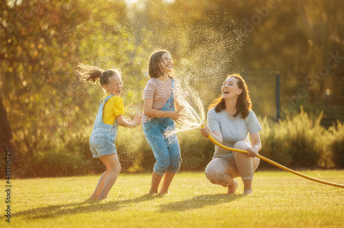 Happy family playing in backyard
