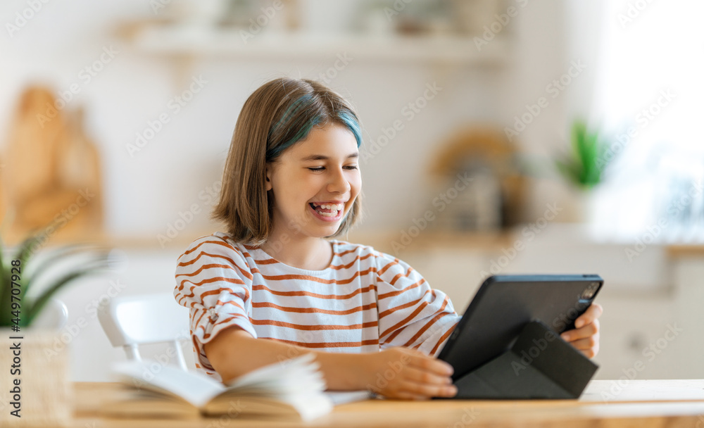 Girl doing homework or online education. Girl doing homework or online education.