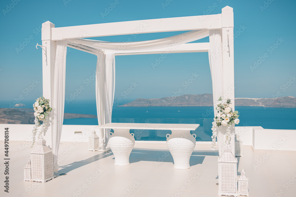 Wedding decorations with minimal white details on the background of the sea, Greece, Santorini. Luxury destination wedding. romantic couple travel vacation background