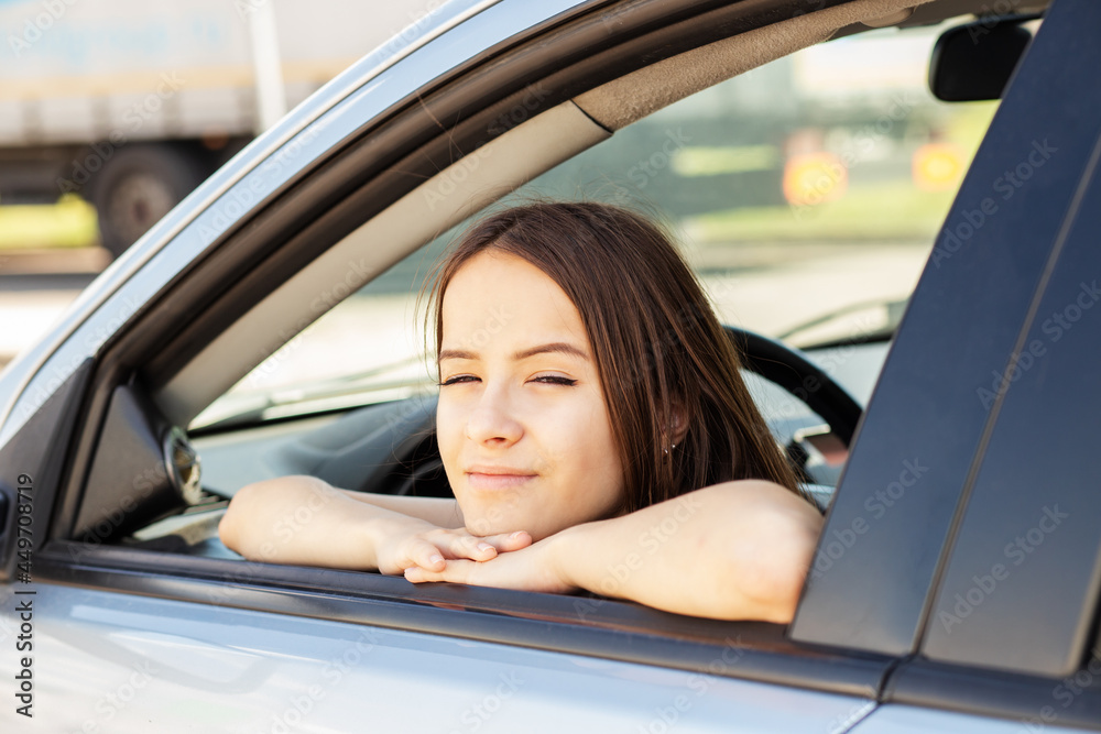 driving school, student driver at a driving school takes an exam in a car to obtain a driver's license driving school, student driver at a driving school takes an exam in a car to obtain a driver's license