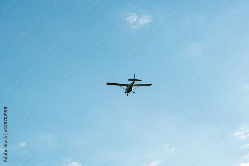 the plane is flying in the blue sky the plane is flying in the blue sky
