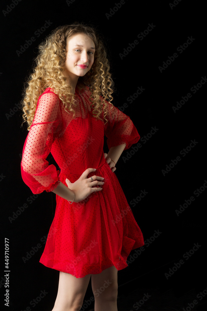 Beautiful happy blonde girl hold hem of her dress Beautiful happy blonde girl hold hem of her dress