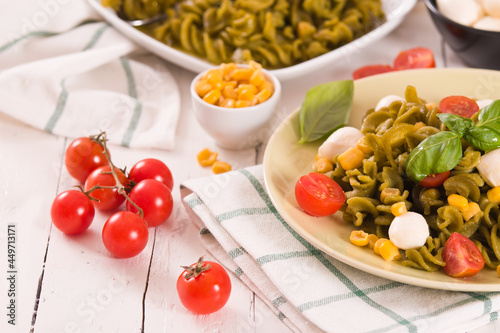 Fusilli pasta with cherry tomatoes and sweet corn. © Mi.Ti.