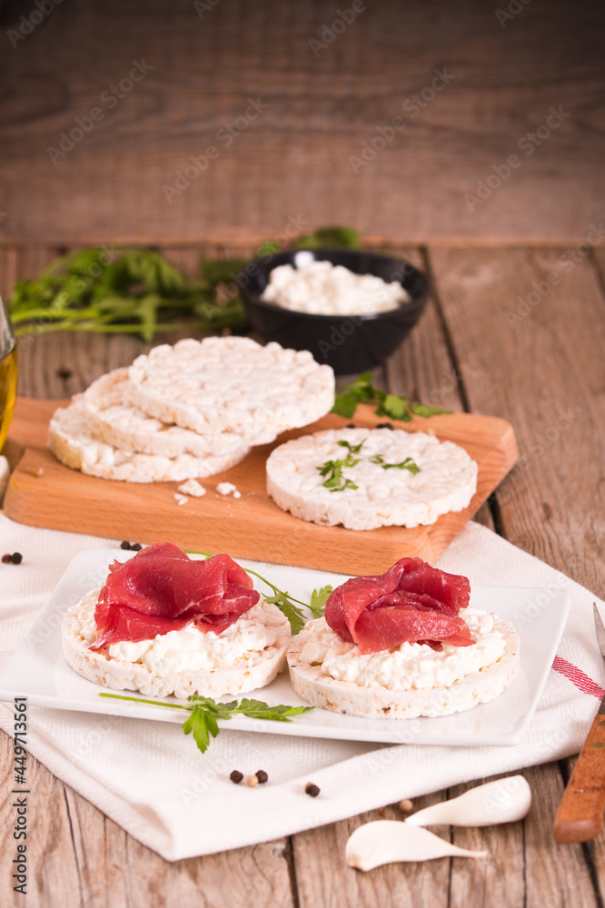 Rice cakes with milk flakes and cold beef. Rice cakes with milk flakes and cold beef.