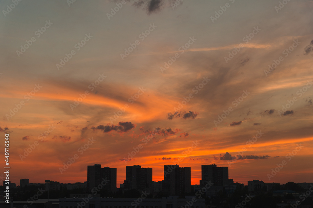 Silhouettes of a metropolis at sunset in a modern city.