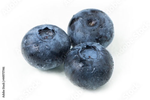 Blueberries with water drops isolated on white