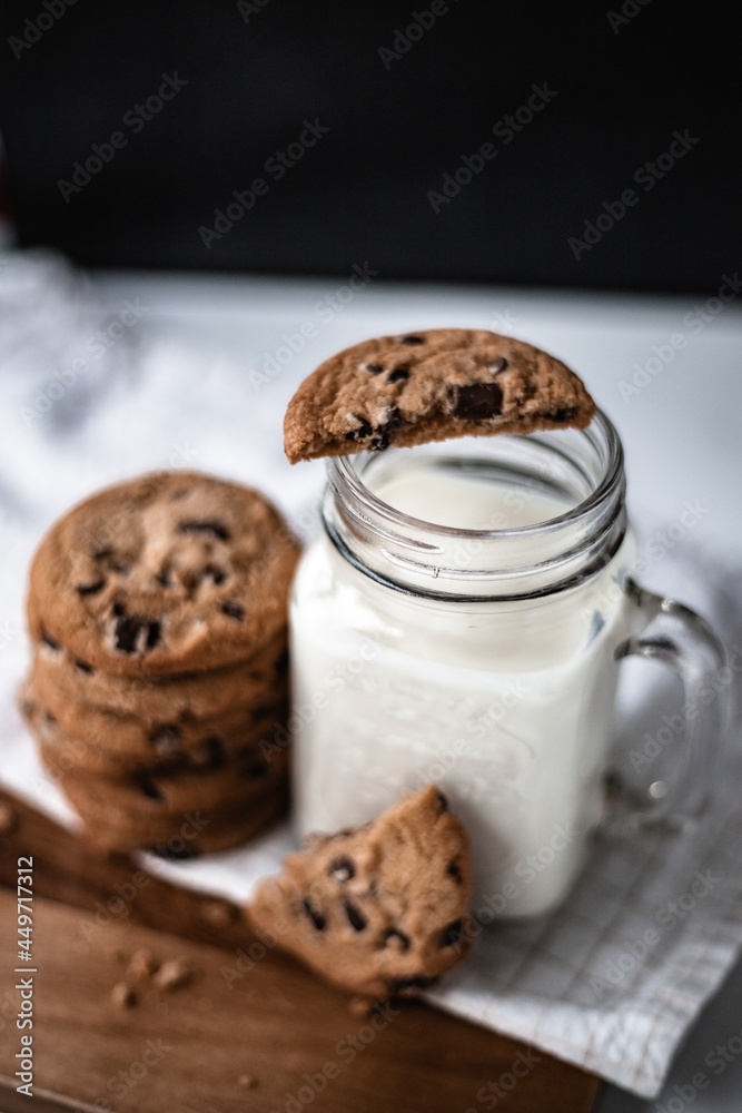 A stack of chocolate chip cookies with milk A stack of chocolate chip cookies with milk