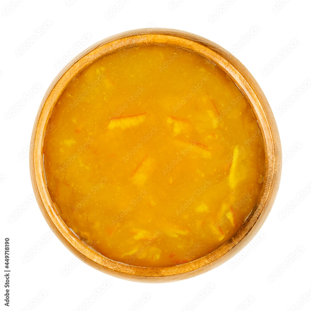 Orange jam, in a wooden bowl. Orange marmalade, a sweet and slightly bitter bread spread, made of cooked oranges, sugar and pectin, with fruit flesh and peel pieces. Close-up, from above, food photo. Orange jam, in a wooden bowl. Orange marmalade, a sweet and slightly bitter bread spread, made of cooked oranges, sugar and pectin, with fruit flesh and peel pieces. Close-up, from above, food photo.