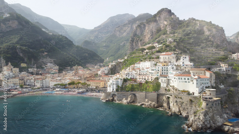 Panoramic aerial view of Amalfi coastline from a moving drone, Campania - Italy.