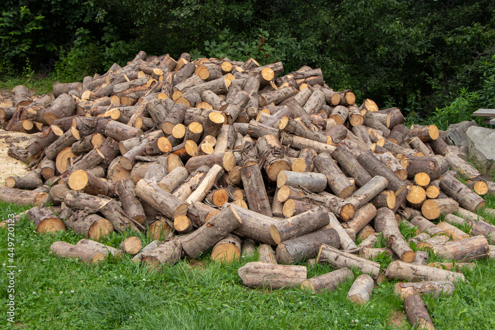 Firewood background - chopped firewood on a stack Firewood background - chopped firewood on a stack