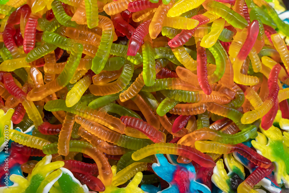 Colorful jelly candies in the form of worms. Candy background