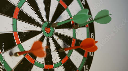 dart on target, Success hitting target aim goal achievement concept background - three darts in bull's eye close up. red three darts arrows in the target center business goal concept