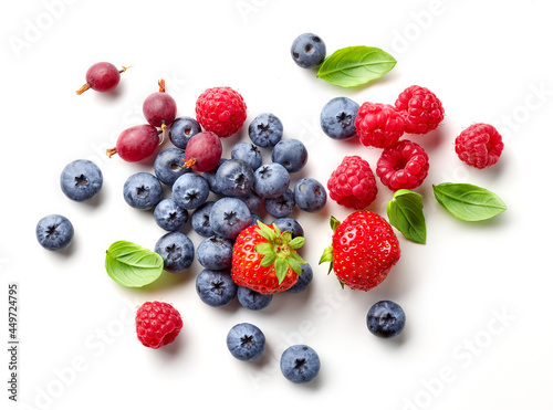 composition of fresh berries and green leaves photo
