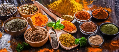 Obraz  z motywem Variety of spices on wooden kitchen table.