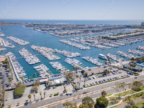 Los Angeles, CA, LA County, June 10, 2021: Aerial Drone Top View of Yacht Clubs at Marina Del Rey with beach, boat pier docks, and apartments by CH