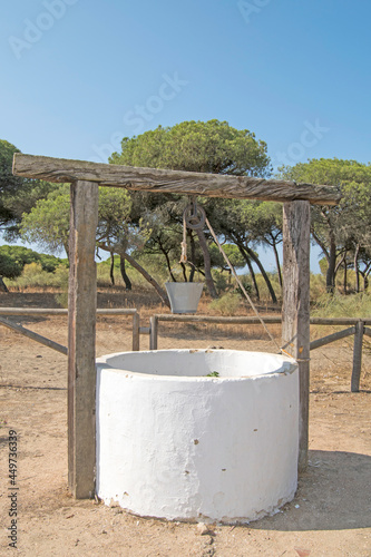 Old water well in the recreational area of ​​Casita Azul beach in Isla Cristina, Huelva, Andalusia, Spain photo