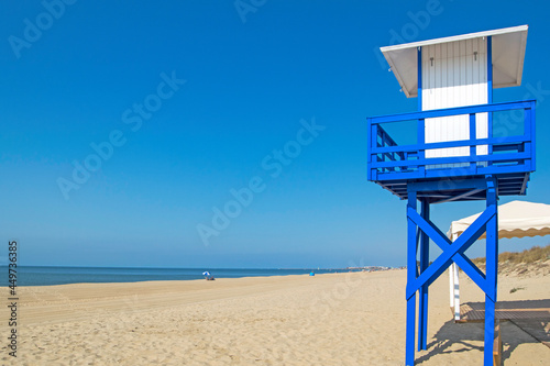 Lifeguard post on the beach of Casita Azul in Isla Cristina, Huelva, Andalusia, Spain photo