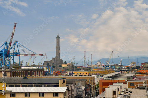 Elevated view of the harbor of Genoa with the lighthouse called Lanterna by the Genoese and cranes, Liguria, Italy