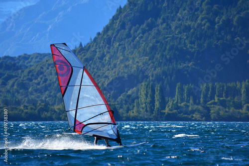 windsurfing on a blue water lake
