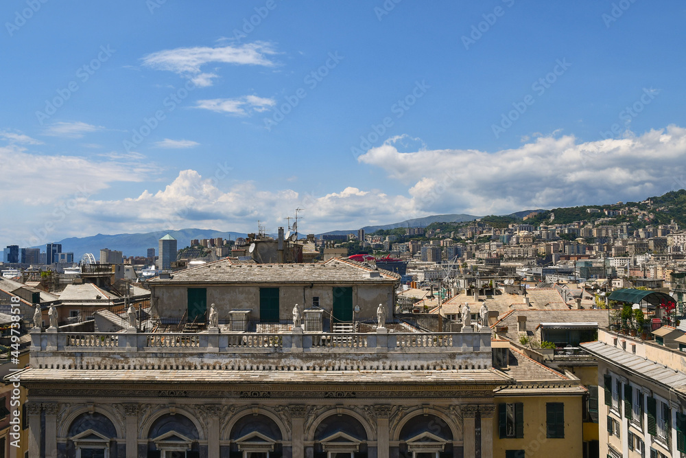 Rooftops view of the coastal city of Genoa with the top of Bendinelli Sauli Palace and the harbor in the background, Liguria, Italy