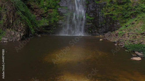 Aerial Wli Waterfalls Ghana tallest in country. Waterfalls is the highest waterfall in Ghana and the tallest in West Africa. It has a lower and an upper fall. Thousands of bat roost on the cliff near  photo