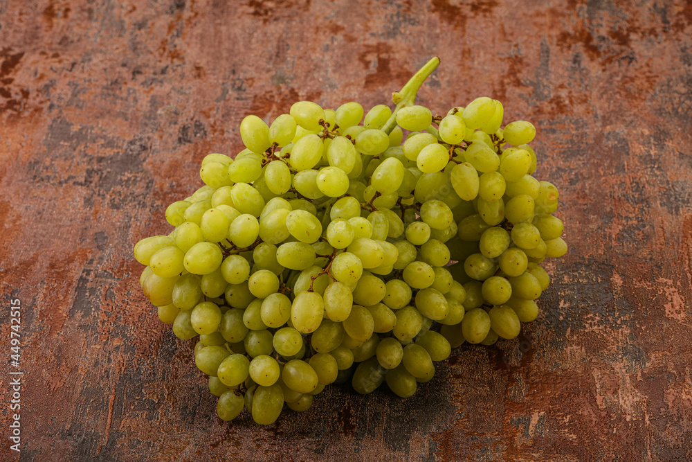 Green grape branch over background Green grape branch over background