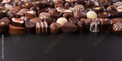 chocolate candy on black background, delicious treat for snack