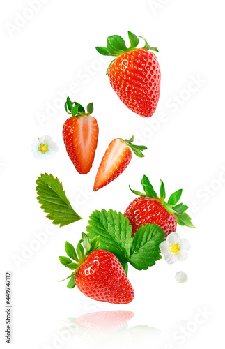 Fresh raw ripe strawberry with green leaves falling in the air, food levitation