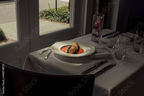 Shrimp and black rice dish inside of a restaurant