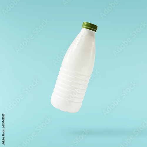 Household cleaning product. A plastic bottle falling in the air