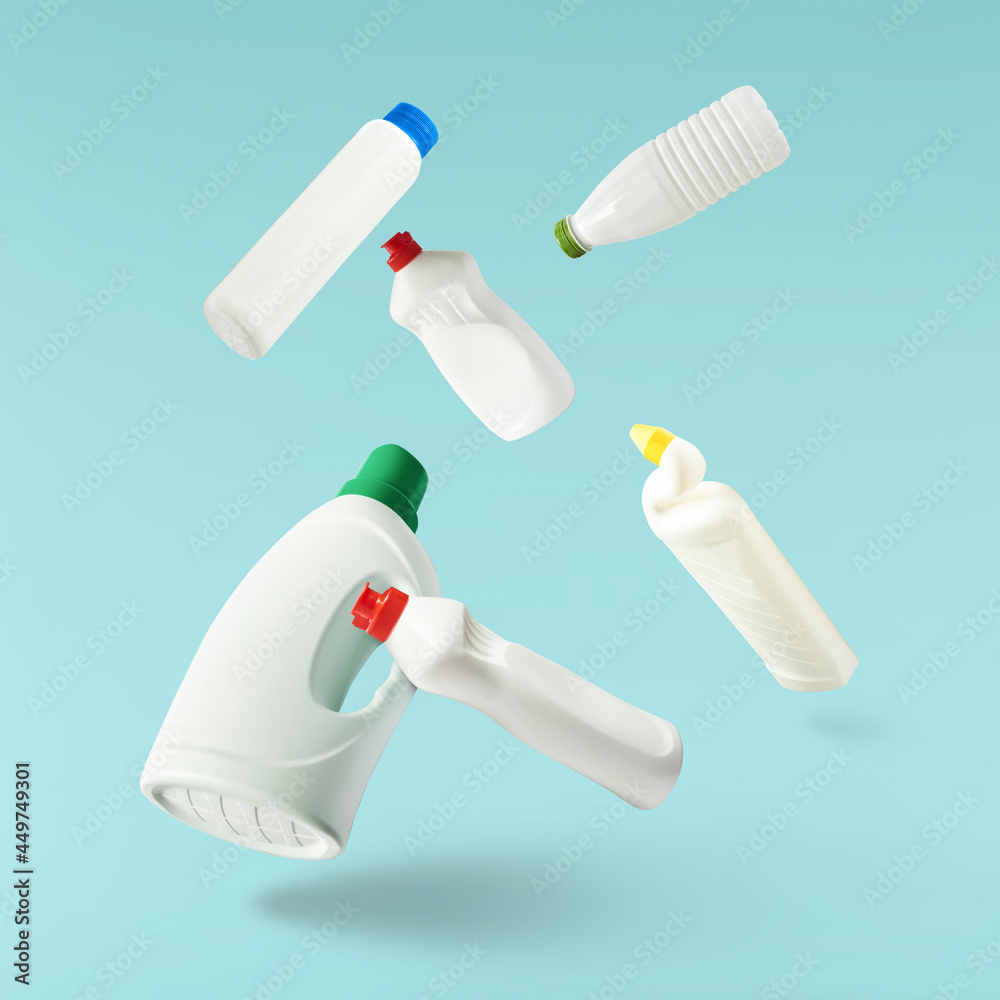Fototapeta premium Household cleaning product. A plastic bottle falling in the air