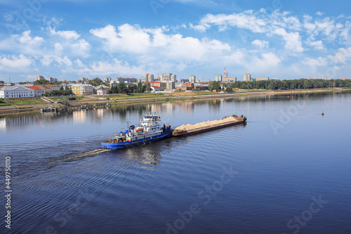 Cargo ship with sand sails along the Volga River
