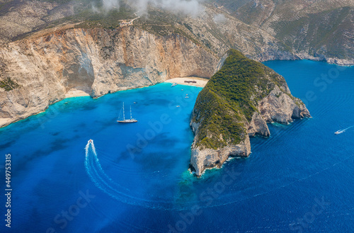 View of Navagio beach, Zakynthos Island, Greece. Aerial landscape. Azure sea water. Rocks and sea. Summer landscape from the air.