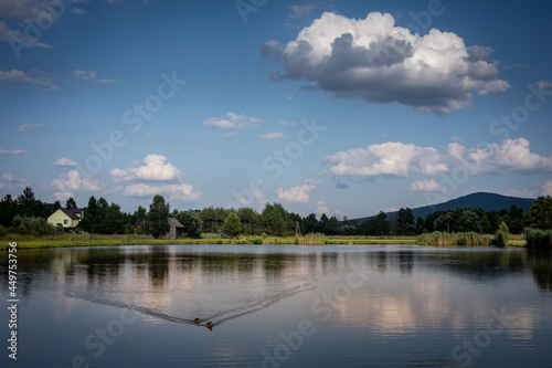 A calm lake view with Lysica Mountain in background. Ciekoty, Swietokrzyskie Mountains, Poland. 