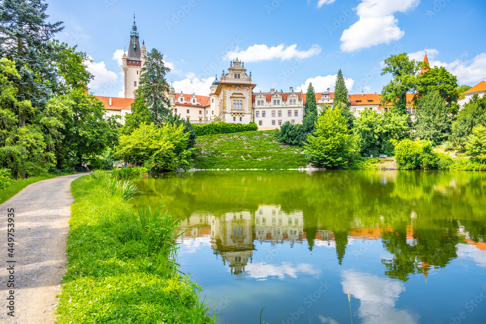 Pruhonice castle and natural park landscape with garden lake on sunny summer day, Pruhenice, Czech Republic. UNESCO World Heritage Site