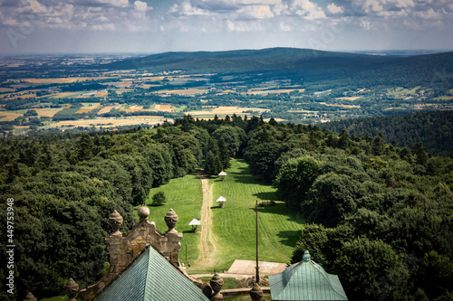 Fototapeta Naklejka Na Ścianę i Meble -  A view from a tower of Swiety Krzyz Church, Swietokrzyskie Mountains, Poland.
Golden fields, forest and mountains in background.