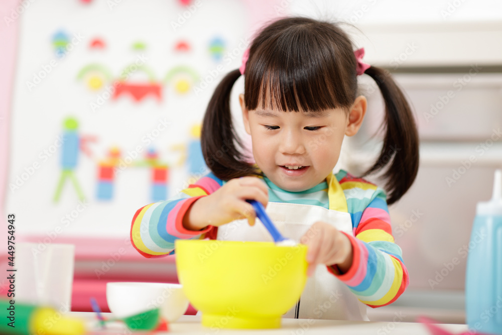 young girl pretend playing food preparing at home young girl pretend playing food preparing at home