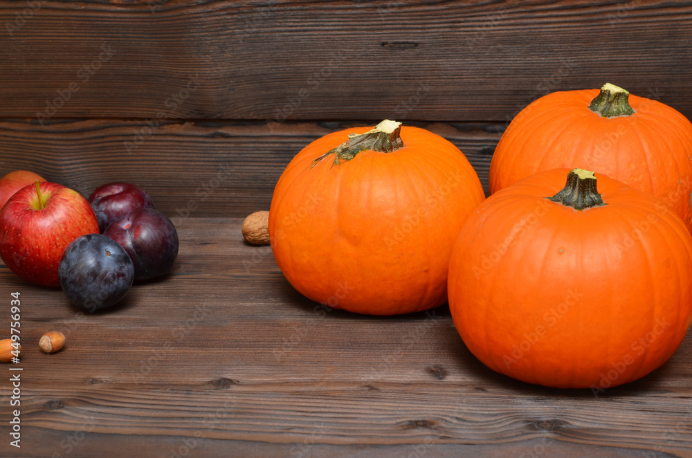harvest of autumn fruits with pumpkin, plum, apples and nuts harvest of autumn fruits with pumpkin, plum, apples and nuts