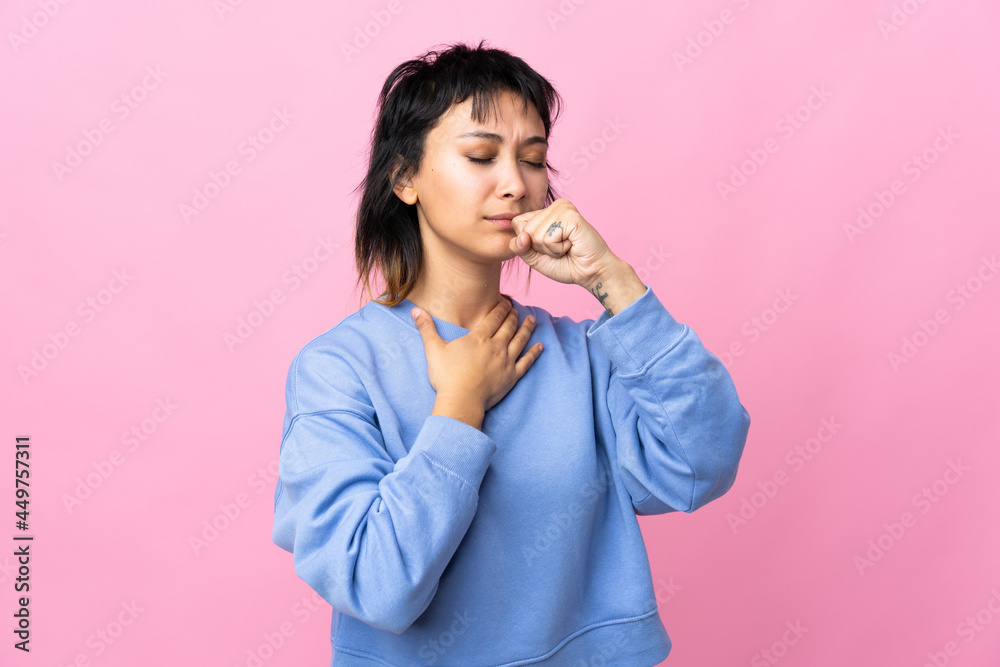 Young Uruguayan woman over isolated pink background coughing a lot Young Uruguayan woman over isolated pink background coughing a lot