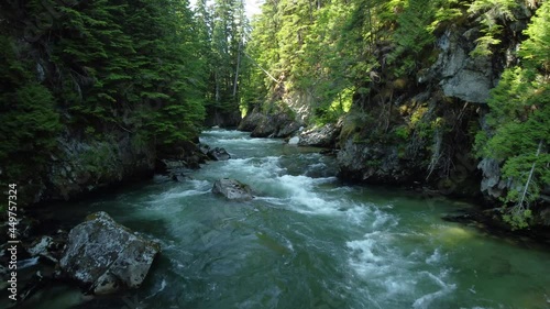 Rounding the bend of a swift moving creek in a forest canyon