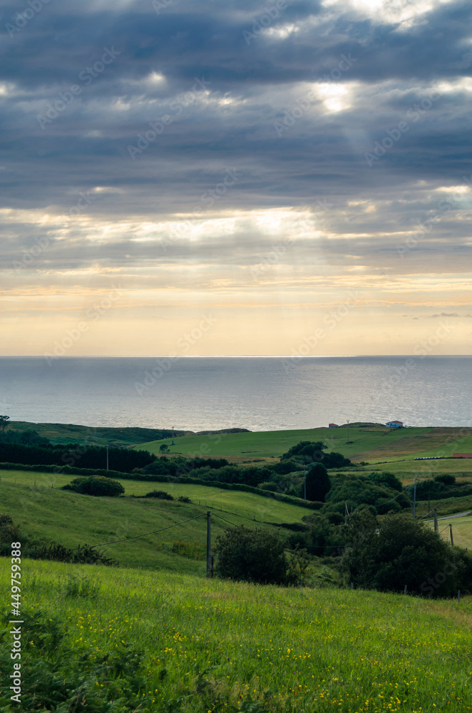 Green coast of Cantabria, northern Spain, at sunset