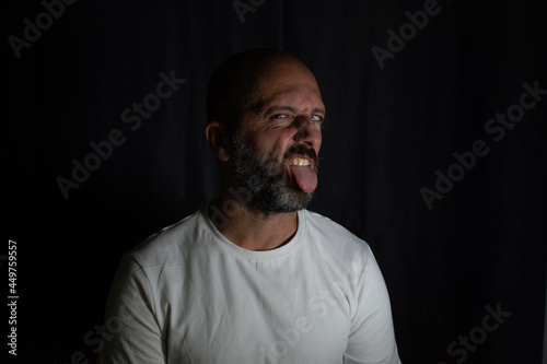 portrait of a man joking with his tongue out