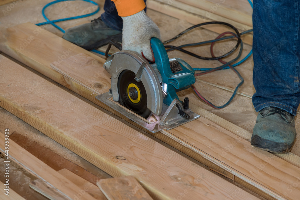 Cutting plywood using an electrical chain saw professional tools